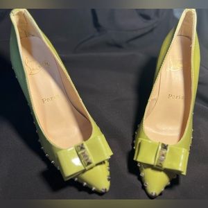 Pale yellow Christian Louboutin studded stilettos!